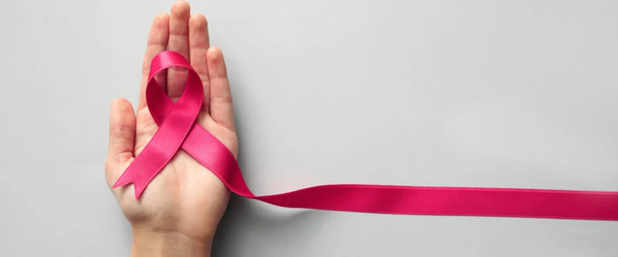 Female oncologist explaining breast cancer symptoms to a patient at Karnawat Cancer Hospital